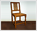 Lattice back chair in fumed oak with studded hide seat